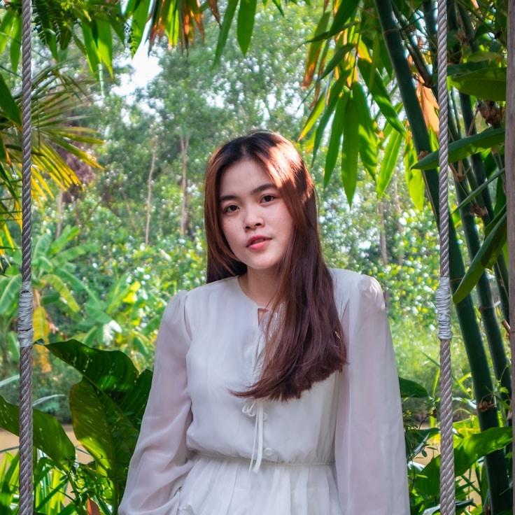 Kaveri Mehta, Lead Design Curator at CoveCrestHarbor, reviewing corporate floral arrangements